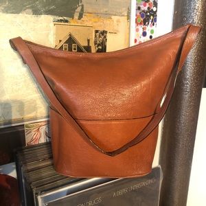 Genuine leather Acorn colored vintage bucket bag.